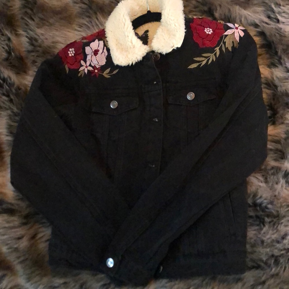 Black denim embroidered with roses